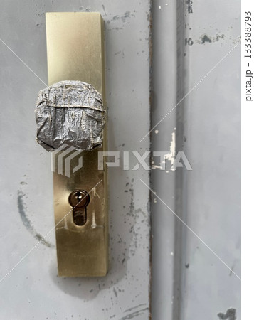 Broken Door Handle Wrapped in Tape 133388793
