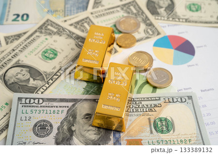 Gold bars with US dollar and Euro banknote money, finance trading investment business currency. Gold bars with US dollar and Euro banknote money, finance trading investment business currency. 133389132