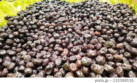 Fresh olives displayed at a local market in daytime Fresh olives displayed at a local market in daytime 133389510