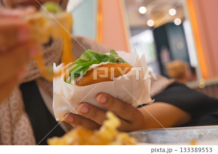 Delicious street food enjoyed in a cozy urban setting Delicious street food enjoyed in a cozy urban setting 133389553