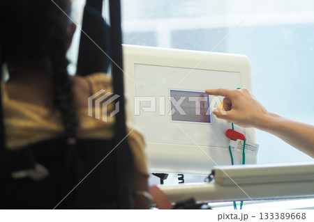 Patient using medical equipment in a hospital Patient using medical equipment in a hospital 133389668