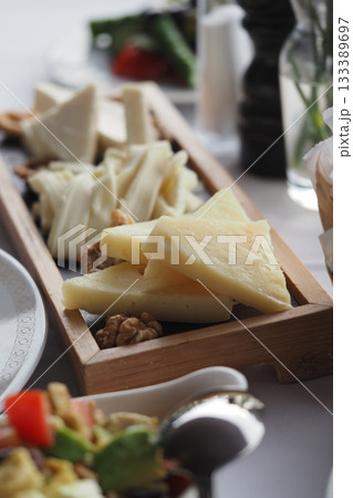 Delicious cheese platter served at a restaurant table 133389697