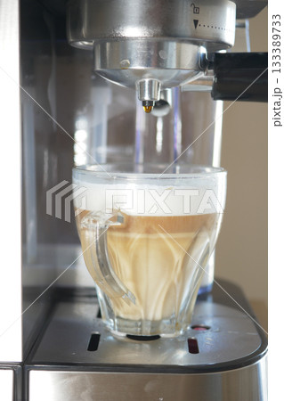 Freshly brewed coffee in a glass cup at home kitchen 133389733