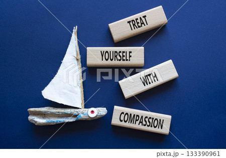 Treat yourself with compassion symbol. Concept words Treat yourself with compassion on wooden blocks with boat. Beautiful deep blue background. Medicine concept. Copy space. Treat yourself with compassion symbol. Concept words Treat yourself with compassion on wooden blocks with boat. Beautiful deep blue background. Medicine concept. Copy space. 133390961