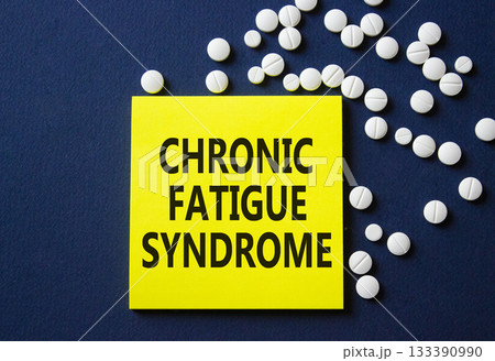 Chronic Fatigue Syndrome symbol. Concept word Chronic Fatigue Syndrome on yellow note. Beautiful deep blue background with pills. Medicine and Chronic Fatigue Syndrome concept. Copy space 133390990