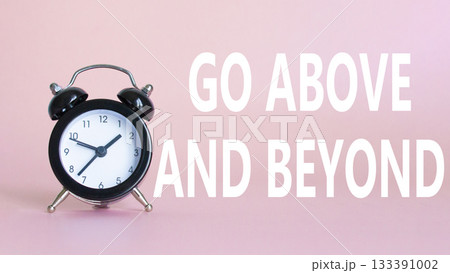 Go above and beyond symbol. Beautiful pink background with alarm clock. Business and Go above and beyond concept. Copy space. 133391002