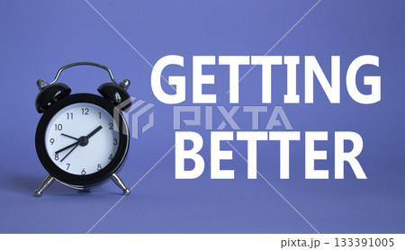 Getting better symbol. Beautiful purple background with alarm clock. Business and Getting better concept. Copy space. Getting better symbol. Beautiful purple background with alarm clock. Business and Getting better concept. Copy space. 133391005