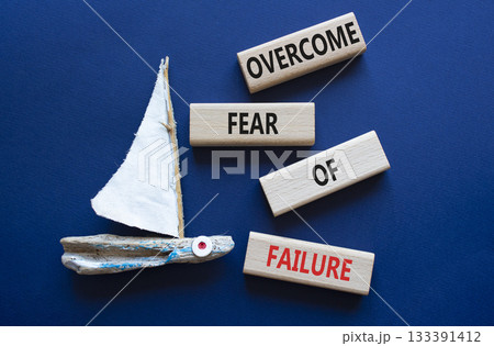 Fear of failure symbol. Concept words Overcome Fear of failure on wooden blocks. Beautiful deep blue background with boat. Business and Fear of failure concept. Copy space. Fear of failure symbol. Concept words Overcome Fear of failure on wooden blocks. Beautiful deep blue background with boat. Business and Fear of failure concept. Copy space. 133391412