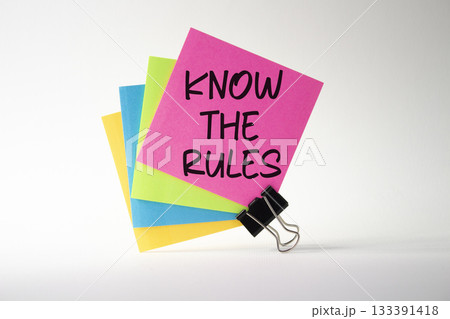 Know the rules symbol. Pink sticky note with paper clips with words Know the rules. Beautiful white background. Business and Know the rules concept. Copy space. Know the rules symbol. Pink sticky note with paper clips with words Know the rules. Beautiful white background. Business and Know the rules concept. Copy space. 133391418