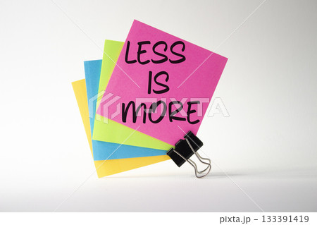Less is More symbol. Sticky Notes with Concept words Less is More. Beautiful white background. Business and Less is More concept. Copy space. Less is More symbol. Sticky Notes with Concept words Less is More. Beautiful white background. Business and Less is More concept. Copy space. 133391419