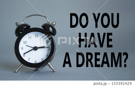 Do you have a Dream symbol. Beautiful grey background with alarm clock. Business and Do you have a Dream concept. Copy space. Do you have a Dream symbol. Beautiful grey background with alarm clock. Business and Do you have a Dream concept. Copy space. 133391429