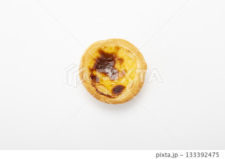 Fresh baked egg tart or custard tart (pastel de nata) isolated on white background Fresh baked egg tart or custard tart (pastel de nata) isolated on white background 133392475