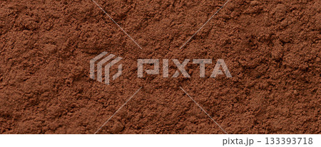 Fine cocoa powder texture in rich brown color creating a natural culinary background ideal for dessert design, baking concepts and product packaging visuals 133393718