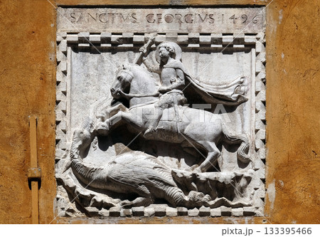 Saint George slaying the dragon, relief on house facade in Venice, Italy 133395466