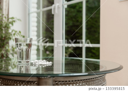 Vitamins and Water Glass on Table Healthy Lifestyle Concept Vitamins and Water Glass on Table Healthy Lifestyle Concept 133395815