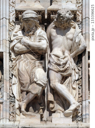 Atlantes supporting the main facade of the Milan Cathedral, Duomo di Santa Maria Nascente, Milan, Lombardy, Italy Atlantes supporting the main facade of the Milan Cathedral, Duomo di Santa Maria Nascente, Milan, Lombardy, Italy 133396625