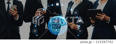 Diverse Business Professionals Collaborating on Digital Technology Solutions with Modern Devices in a Professional Setting Trope Diverse Business Professionals Collaborating on Digital Technology Solutions with Modern Devices in a Professional Setting Trope 133397742