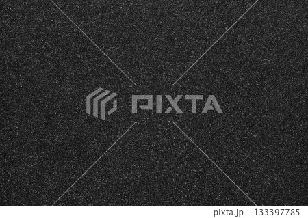 Black glitter creating textured, shimmering surface. Background offering sparkling, abstract and metallic feel for design Black glitter creating textured, shimmering surface. Background offering sparkling, abstract and metallic feel for design 133397785