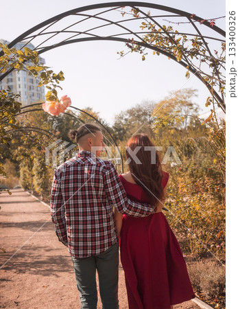 young couple in love walking and having fun in autumn park 133400326