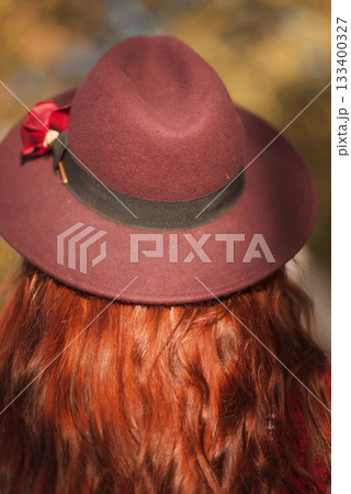 Close-up of a dark red felt female hat Close-up of a dark red felt female hat 133400327