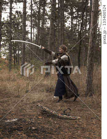 art photo of a warrior girl with a sword in her hands 133400524