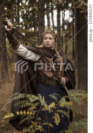art photo of a warrior girl with a sword in her hands 133400525