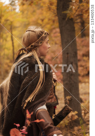 warrior girls with sword in hands in autumn forest. 133400538