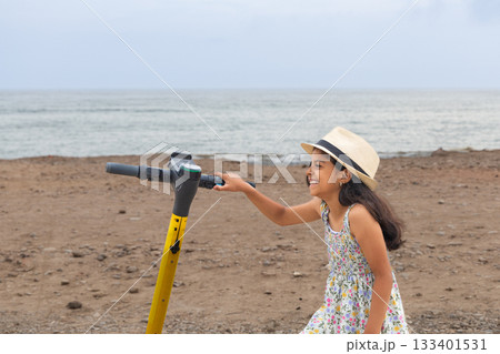 Cute little girl is contemplating the landscape 133401531