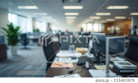 Abstract blurred office interior room. The sleek and modern office furniture, with a desk cluttered with papers and a state-of-the-art computer Abstract blurred office interior room. The sleek and modern office furniture, with a desk cluttered with papers and a state-of-the-art computer 133403979