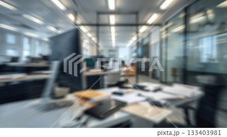 Abstract blurred office interior room. The sleek and modern office furniture, with a desk cluttered with papers and a state-of-the-art computer Abstract blurred office interior room. The sleek and modern office furniture, with a desk cluttered with papers and a state-of-the-art computer 133403981