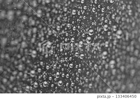 Rain drops on the glass dark moody texture background Rain drops on the glass dark moody texture background 133406450
