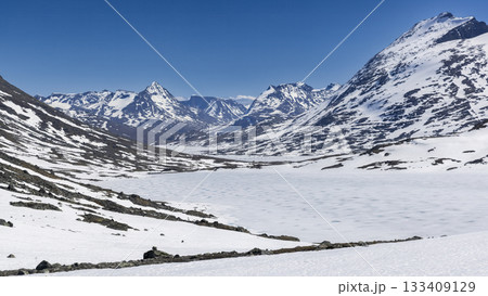 Breathtaking snow-covered landscape at Leirvassbu in Jotunheimen National Park during a clear day 133409129