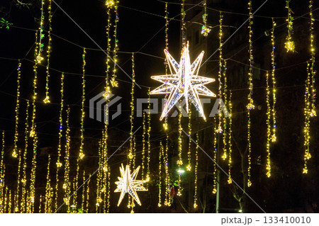 Christmas lights on a city streets. Christmas urban decorations Christmas lights on a city streets. Christmas urban decorations 133410010