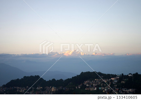 Breathtaking View of Mount Kanchenjunga Peak in Sunset Glow Over Darjeeling Town 133410605