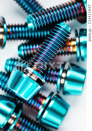 Lightweight and durable titanium bolts with hexagon head and washer on a bright white background 133411647