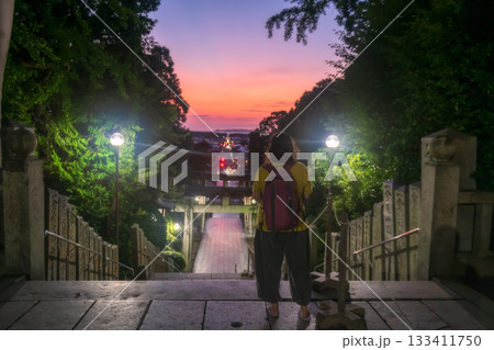 Tourist view torii gate and city from Miyajidake temple at dusk, Fukuoka 133411750