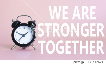We are stronger together symbol. Beautiful pink background with alarm clock with words We are stronger together. Business and We are stronger together concept. Copy space. We are stronger together symbol. Beautiful pink background with alarm clock with words We are stronger together. Business and We are stronger together concept. Copy space. 133412671