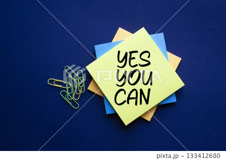 Yes You Can symbol. Concept words Yes You Can on white sticky notes. Beautiful deep blue background. Business and Yes You Can concept. Copy space. 133412680