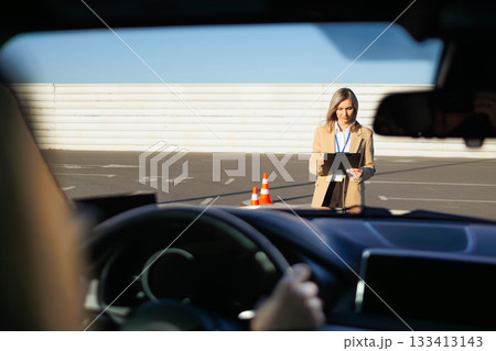 Driving Test Evaluation from Inside the Car with Instructor Ahead on Track 133413143