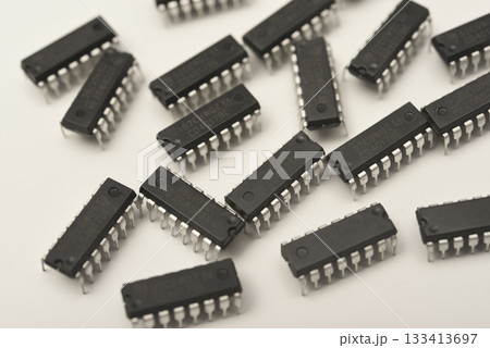 Microchips in a DIP case on a white background. A microelectronic element. Black microchips. Microchips in a DIP case on a white background. A microelectronic element. Black microchips. 133413697