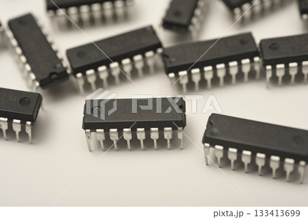 Microchips in a DIP case on a white background. A microelectronic element. Black microchips. Microchips in a DIP case on a white background. A microelectronic element. Black microchips. 133413699