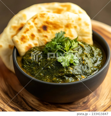 Delicious Palak Paneer with Naan Garnished with Fresh Coriander 133413847