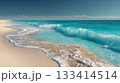 Tranquil beach scene with turquoise waves lapping against golden sands under a clear sky. 133414514