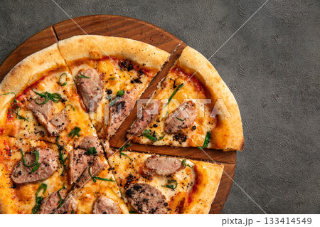 Duck pizza with sliced meat and herbs 133414549