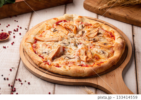 Chicken mushroom pizza on wooden board 133414559