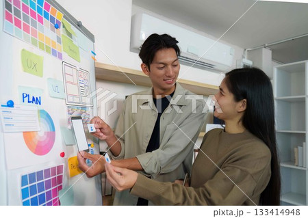Creative Collaboration. Young professionals discussing UI design ideas. Creative Collaboration. Young professionals discussing UI design ideas. 133414948