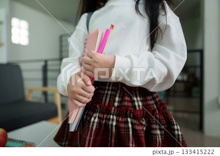 Child Studying with Notebooks and Apple on Desk 133415222