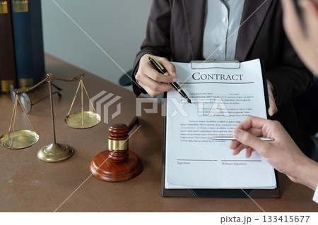 Contract Review. Lawyer explaining legal terms to client in office. 133415677