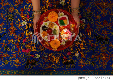 Colorful Puja Thali with Ritual Offerings and Flowers Colorful Puja Thali with Ritual Offerings and Flowers 133415773