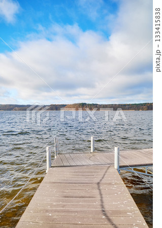 Pier on Lake Charzykowskie in autumn, Charzykowy, Poland. 133415838